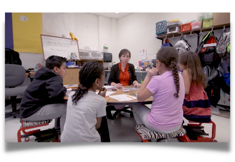 teacher in classroom with students1